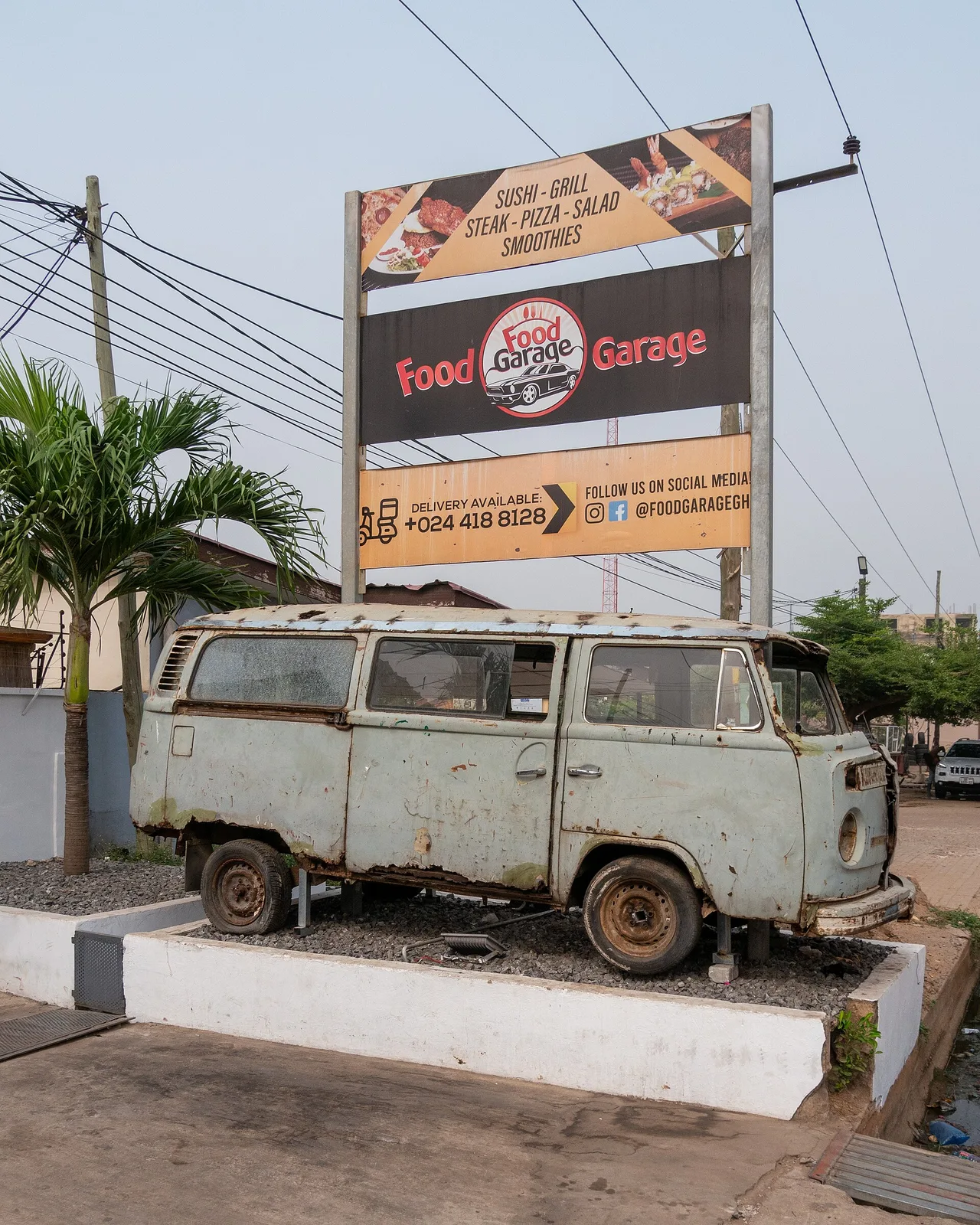 Food Garage entrance and vintage Volkswagen in East Legon